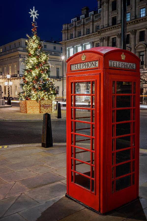 a-red-phone-booth-in-london-england-on-a-beautiful-night-during-christmas-george-afostovremea